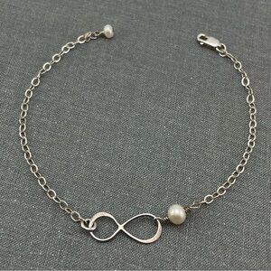 Elegant Sterling Silver Infinity Bracelet with Freshwater Pearl Accent